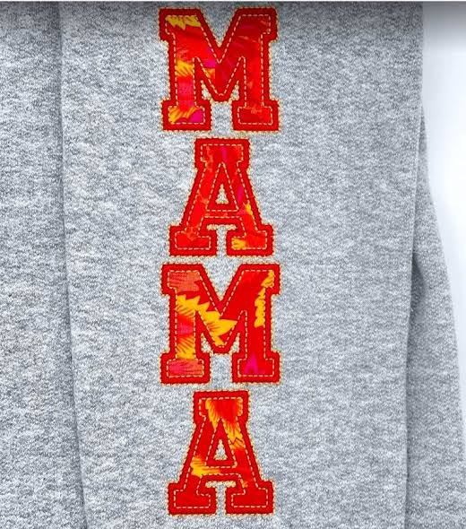 Mama vertical lettering sleeve embroidery digitizing on a grey sweatshirt
